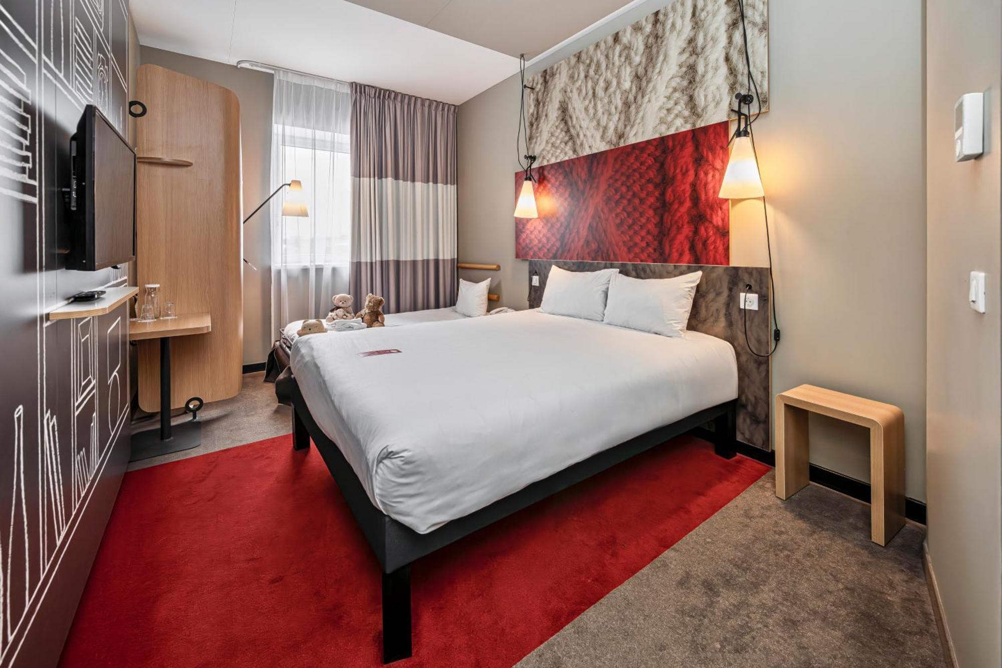 Room with one Queen bed and sofa