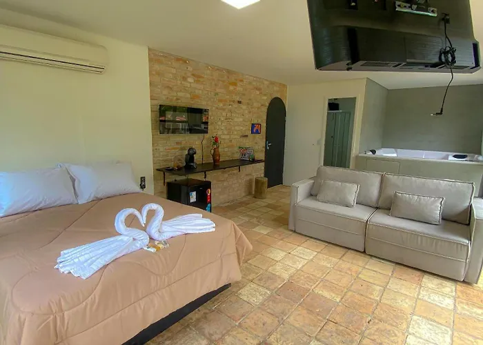 Frente ao Mar - Suites com Piscina Aquecida, SPA Privativo, Vista ao Mar ou Montanha, com Estacionamento- Raizes do Mar ECO Hotel